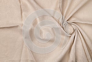 Natural linen fabric texture. Flaxen circular spiral textile background photo