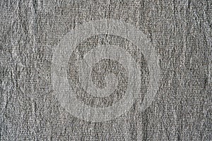 Natural linen texture background. Crumpled fabric of gray color, rough texture