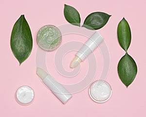 Natural lip skin care products with green leaves