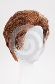 Natural looking brunet wig on white mannequin head