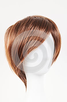 Natural looking dark brunet wig on white mannequin head