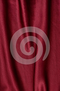 Natural magenta red silk fabric with folds texture