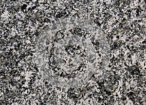 Magmatic granite rock dotted grains texture with black and white minerals photo