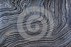 Natural marble is a gray stone with dark stripes called Silver Wave