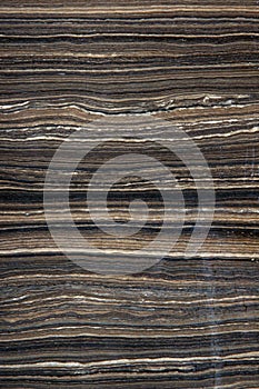 Natural marble with horizontal stripes brown color, called Tobacco Brown or Eramosa