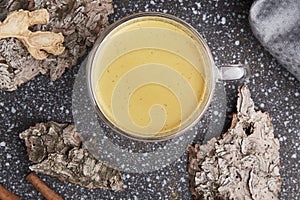 Natural masala tea with spices on tree bark. Healthy traditional indian drink. Hygge cozy home concept