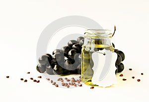 Natural oil. Glass jar of grape seed oil with a tag for text.