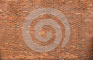 Natural old vintage weathered red brown solid brick wall. Abstract copy space background.