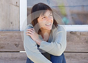 Natural older lady smiling outside