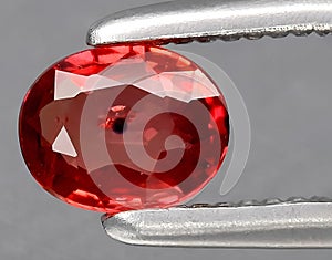 natural orange padparadscha sapphire gem on the background