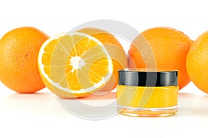 Natural orange sugar lip scrub on white.