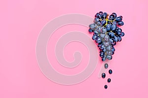 Natural organic black juicy grapes on a trend pink background Top View Flat Lay. Rustic Style. Country Village