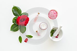 Natural organic cosmetics with rose extract on white background top view