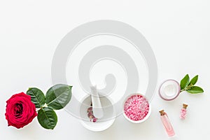 Natural organic cosmetics with rose extract on white background top view copyspace