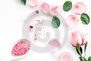 Natural organic cosmetics with rose oil. Cream, lotion, spa salt on white background top view