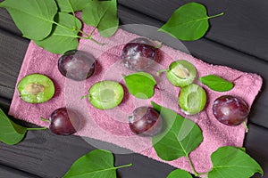 Natural organic fresh plums with leaves