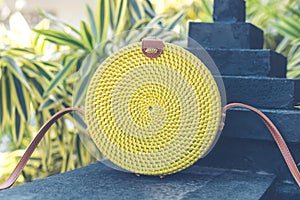 Natural organic handmade rattan handbag closeup. Yellow color.