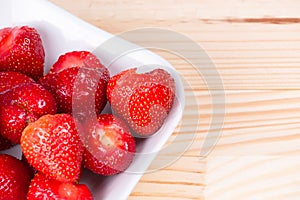 Natural organic strawberries bowl wooden background