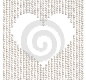 Natural pale pearl beads necklace with heart shaped copy space in the middle, isolated on white