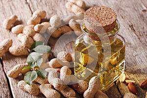Natural peanut oil in a glass jar close up. Horizontal