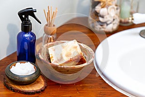 Natural personal care items on a wooden bathroom counter