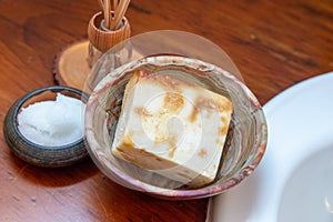 Natural personal care items on a wooden bathroom counter