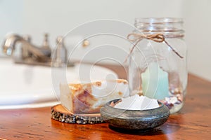 Natural personal care items on a wooden bathroom counter