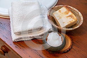 Natural personal care items on a wooden bathroom counter