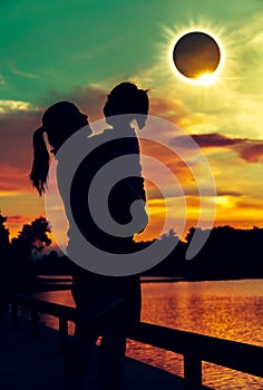 Natural phenomenon. Mother and daughter looking at solar eclipse