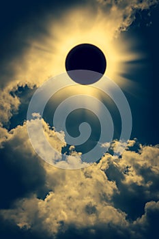 Natural phenomenon. Solar eclipse space with cloud on gold sky b photo