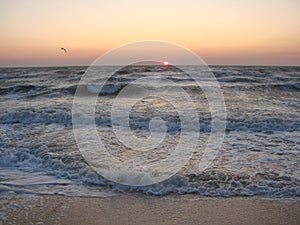 Natural picture of the rainbow colors of sunrise on the coast of the Azov Sea.