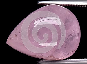 natural pink morganite beryl gem on the background