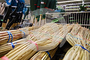 Natural and plastic brooms, shovels and household tools