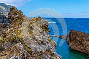 Natural pools with black volcanic rock in the Atlantic Ocean Porto Moniz, Madeira, Portugal