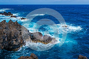 Natural pools with black volcanic rock in the Atlantic Ocean Porto Moniz, Madeira, Portugal