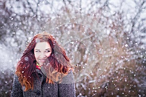 Natural portarit of young woman in snowy weather photo