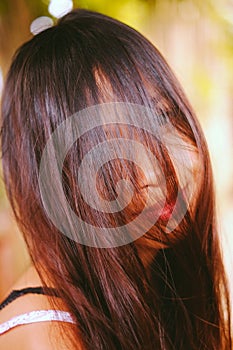 Natural portrait, Asian girl smiling with hair on her face. Native Asian beauty. Local Asian people