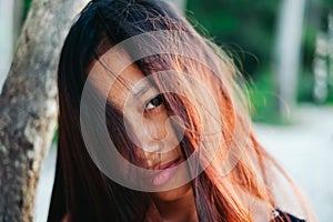 Natural portrait of beautiful young Asian girl smiling. girl with messy hair