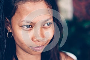 Natural portrait of beautiful young native Asian woman smiling