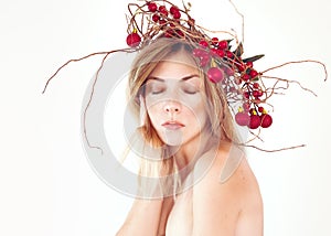 Natural portrait of a woman at 30s with Christmas wreath on her head