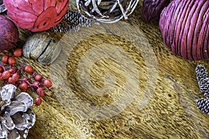 Natural potpourri, berries and pinecones on rustic wooden surface, background