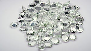 natural prasiolite green amethyst gemstone on the white background on the turning table