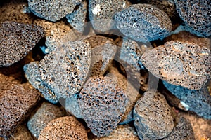 Natural pumice stones, close-up photo. Gray, brown stone.