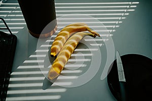 Natural radiance showcases a banana on the kitchen tabletop