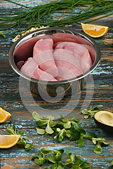 Natural raw ingredients for healthy food on rough dyed wooden background.