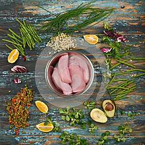 Natural raw ingredients for healthy food on rough dyed wooden background.