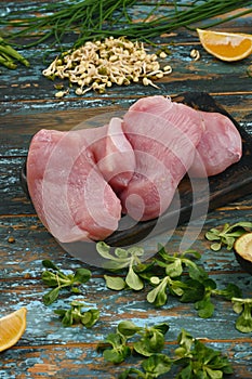 Natural raw ingredients for healthy food on rough dyed wooden background.