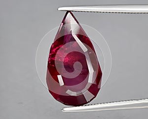 natural red rhodolite garnet gem on the background photo
