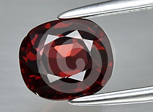 natural red spinel gem on the background