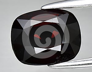 natural red spinel gem on the background